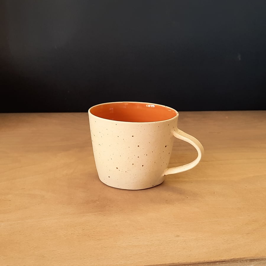 Hand made burnt orange and cream stoneware ceramic mug cup