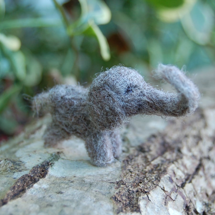 Miniature elephant in a tin, needle felt elephant, wool elephant