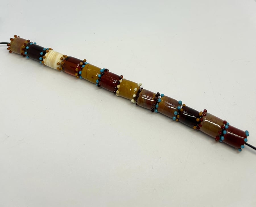 Handmade brown and amber lamp work glass beads