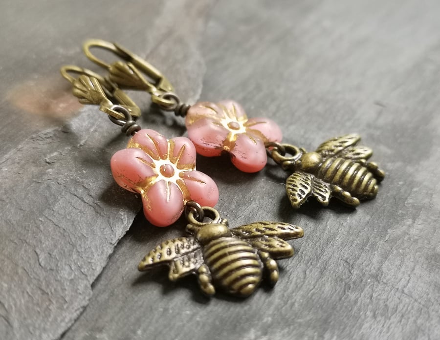Pink flower and antique gold bee charm earrings, lever back ear wires 