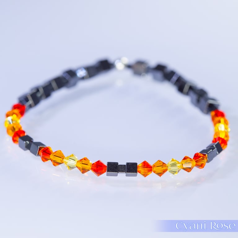 Bracelet handmade with Swarovski and Hematite beads stretchy black and orange