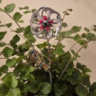 Silver, red, black flower plant companion perfect for pot plants