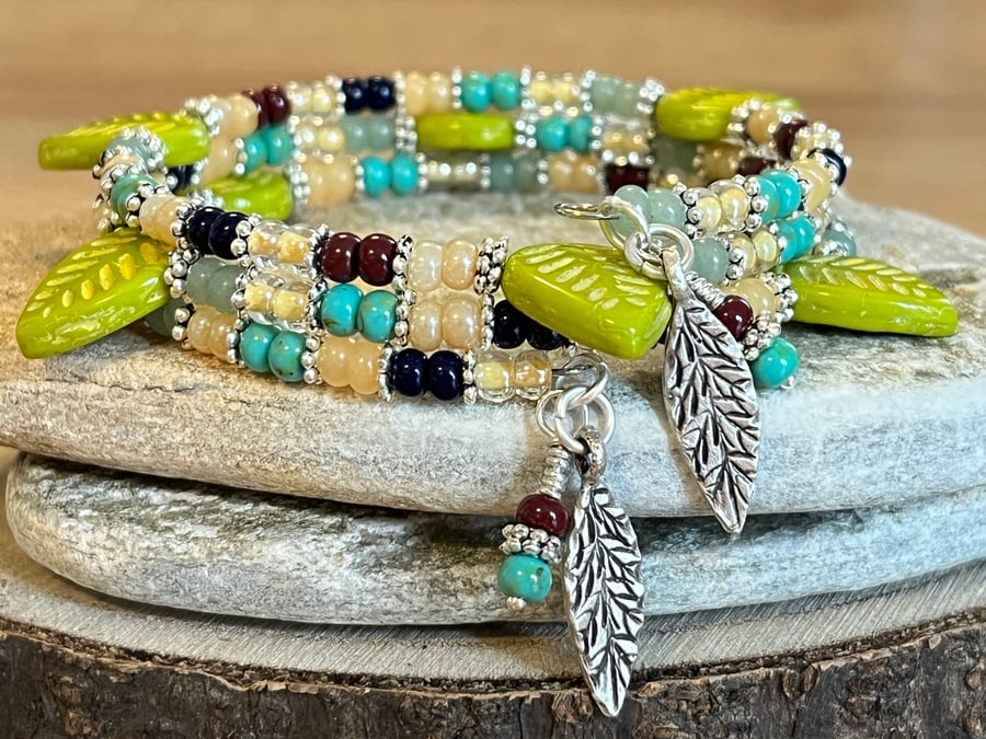Colourful beaded memory wire wrap bracelet with lime green Czech leaves