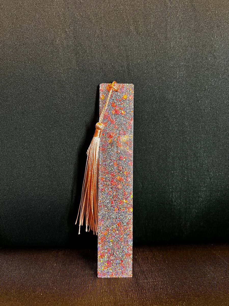 Silver, and peach bookmark.