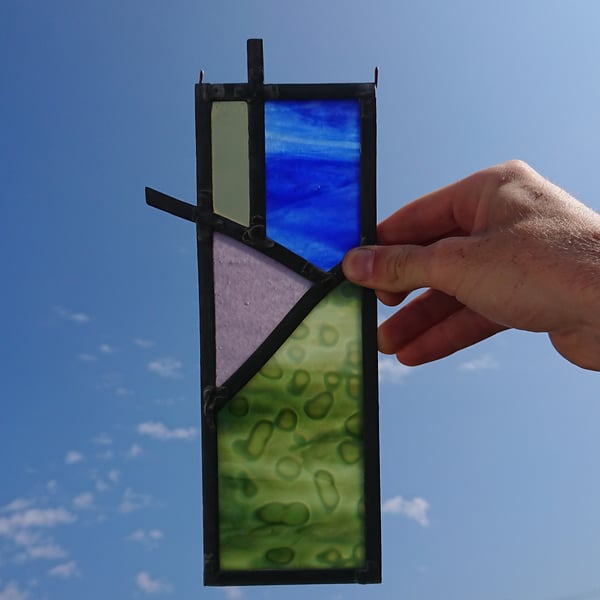 Stained glass abstract landscape, meadow, mountain, sun, sky leaded panel