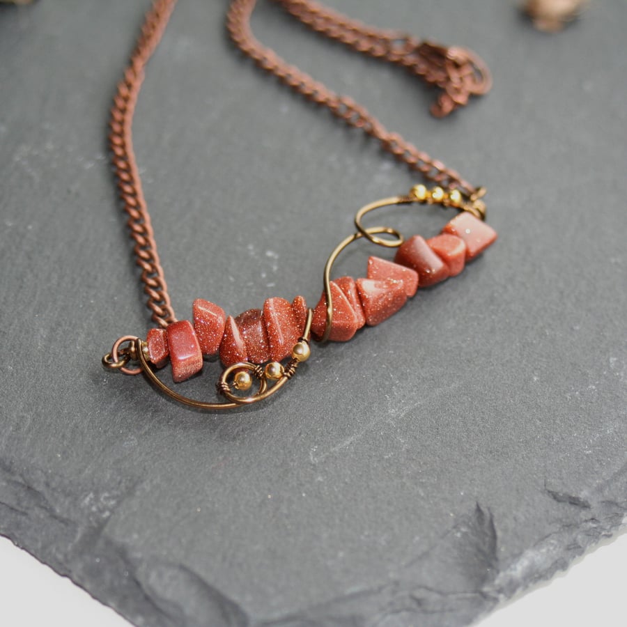 Wire wrapped goldstone necklace