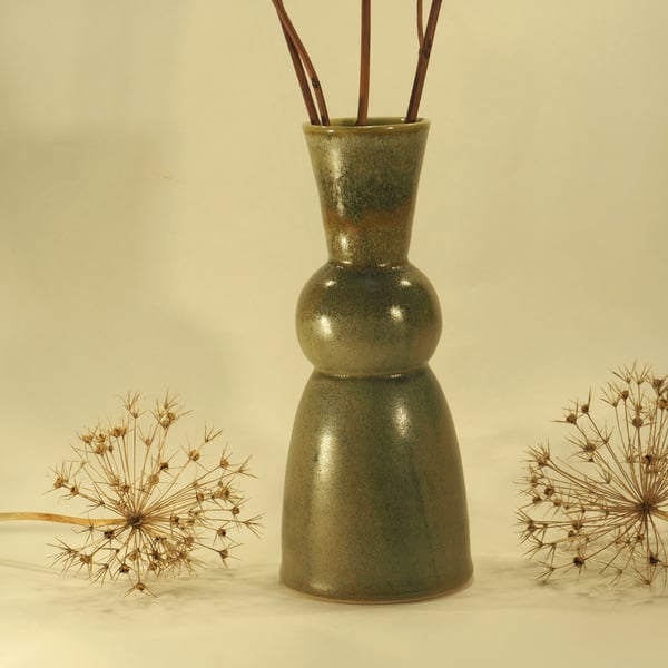 Green vase with sphere