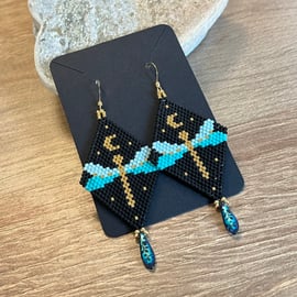 Beaded dragonfly earrings in turquoise black and gold with a Czech teardrop 