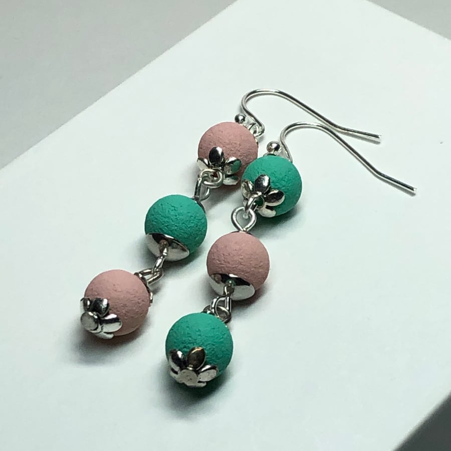 Mismatched pink cyan lava rock earrings