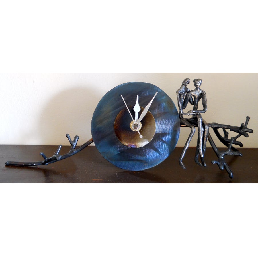 branch mantle clock with lovers sitting