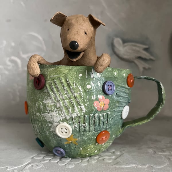 Paper mache puppy dog in a cup assemblage art