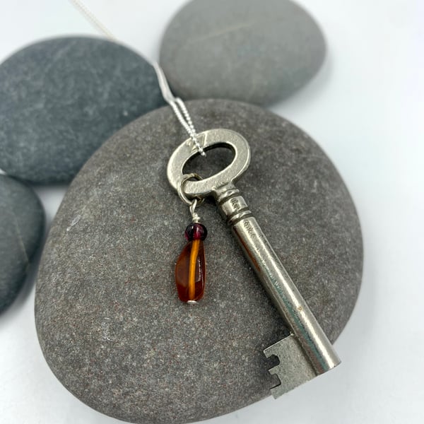 Vintage key pendant with amber beads on silver chain