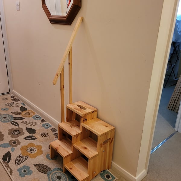 Step Up Easy "tm" branded step ladders with banister wood.