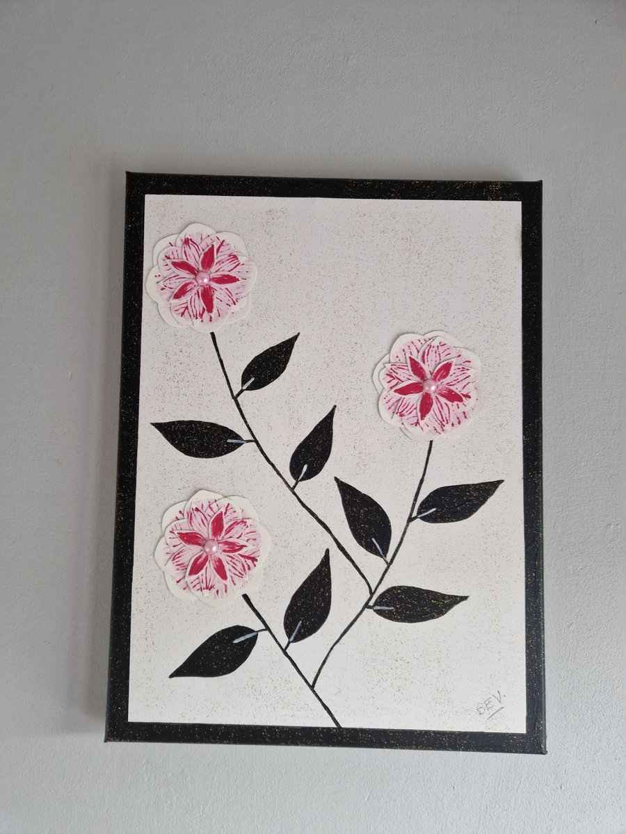 A collage of camellias on canvas. 