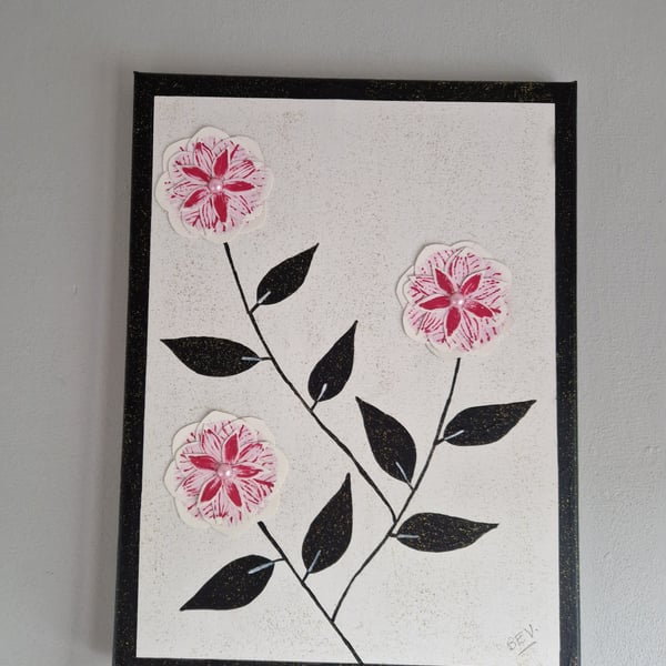 A collage of camellias on canvas. 