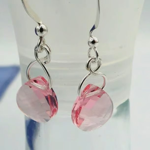 Pretty pink crystal earrings on a silver hook.  Stocken fillers  Sparkly