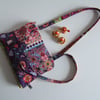 Handbag or shoulder bag in a Folk art fabric with chunky zip closure.
