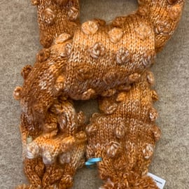 Hand Knitted Bobble Scarf in a Rust Colour 