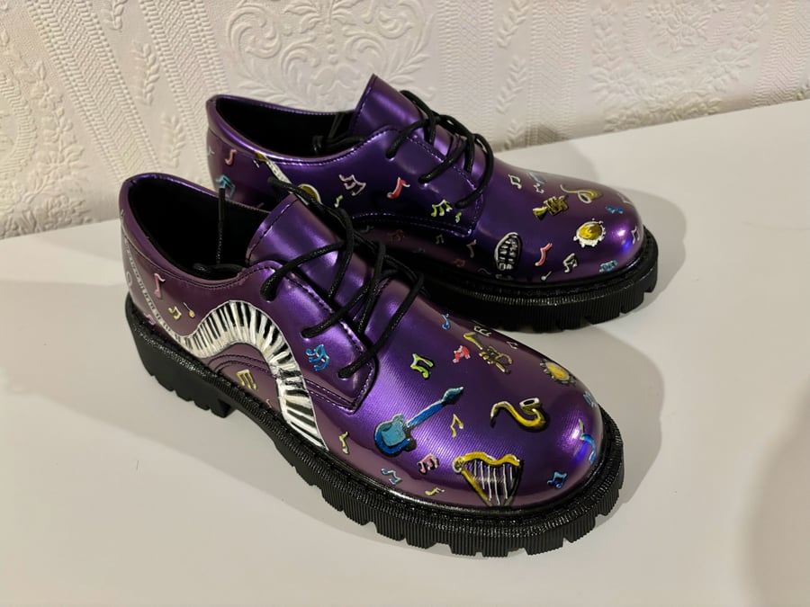 A hand painted and sealed pair of shoes by Andrew Jenkins 