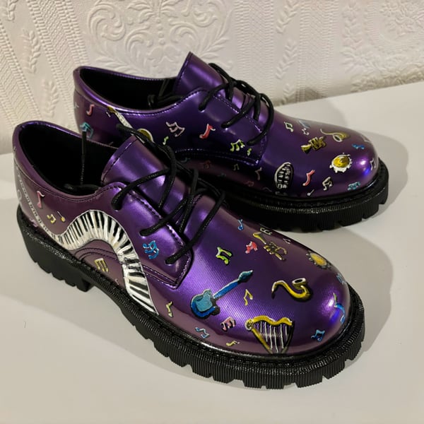 A hand painted and sealed pair of shoes by Andrew Jenkins 