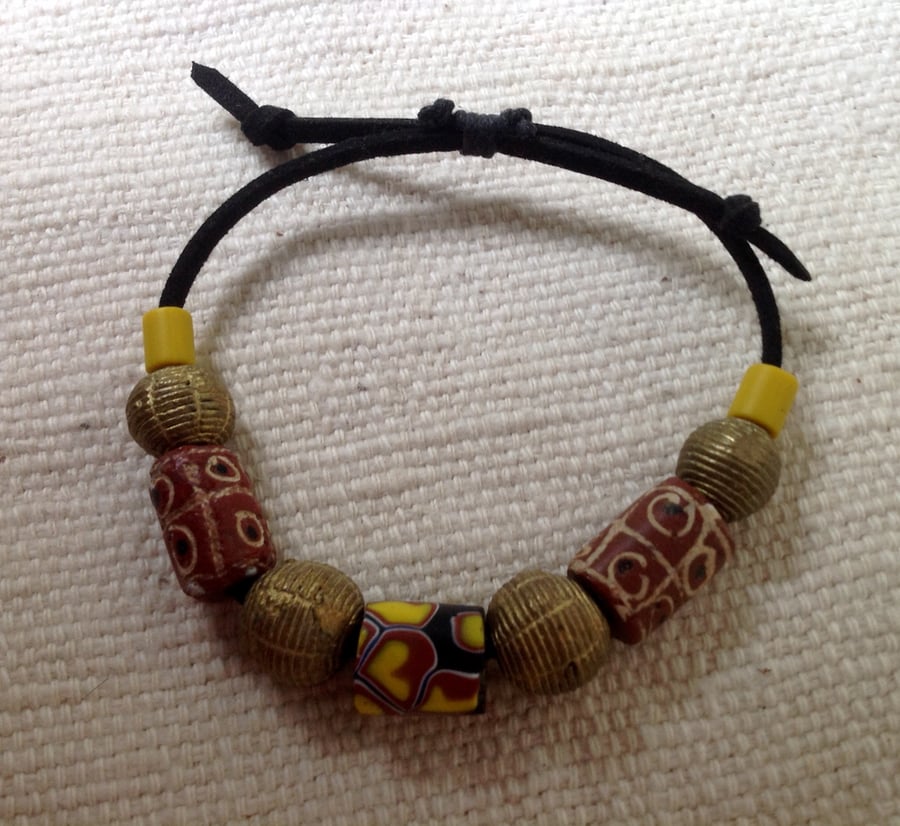 Adjustable cord bracelet with antique trade beads from Venice and African brass 