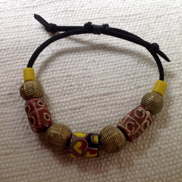 Adjustable cord bracelet with antique trade beads from Venice and African brass 