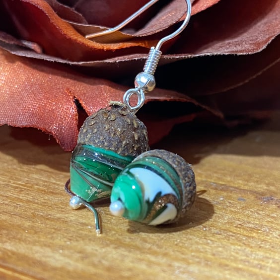 From tiny acorns - lamp work glass acorn earrings.