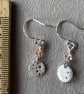 Circular silver earrings with bubble pattern and pale pink Swarovski crystals  - Image 2
