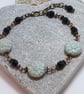 Black and pale mint green dahlia flower bead bracelet