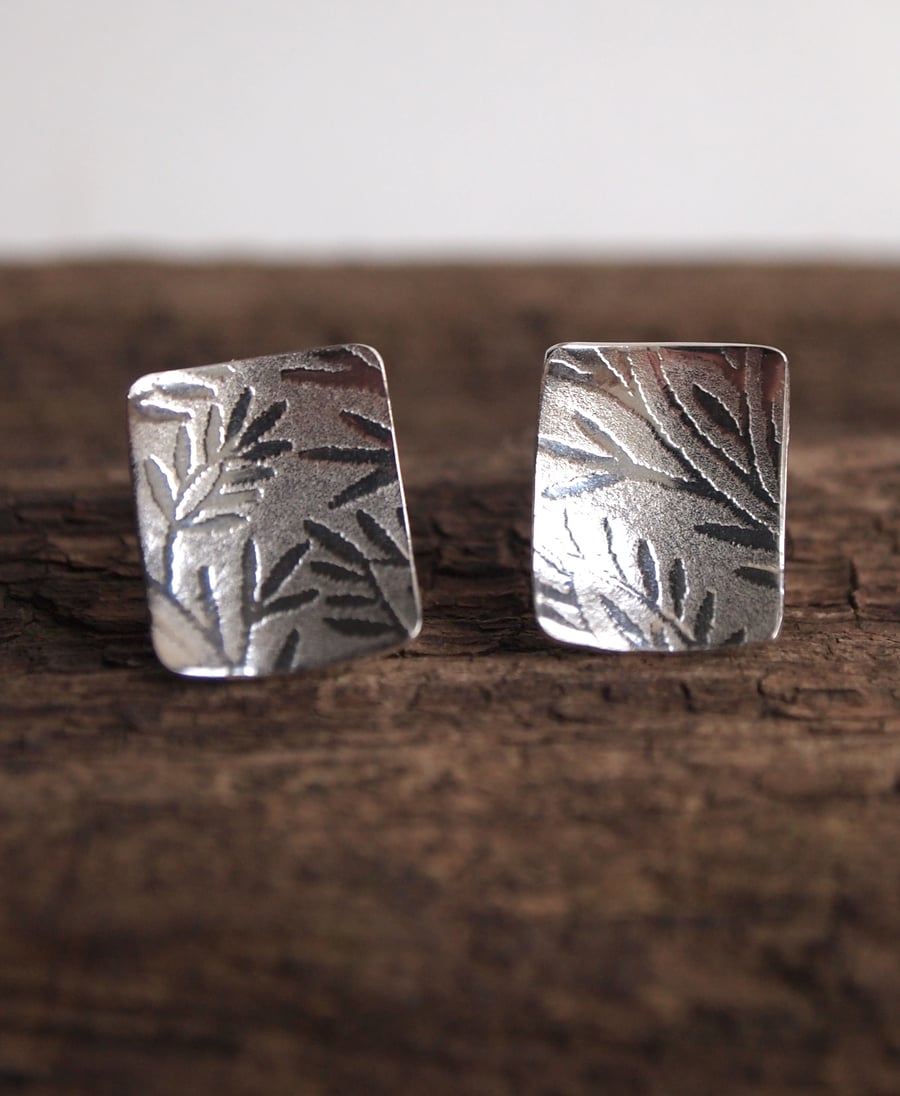 silver stud earrings, leaf earrings.