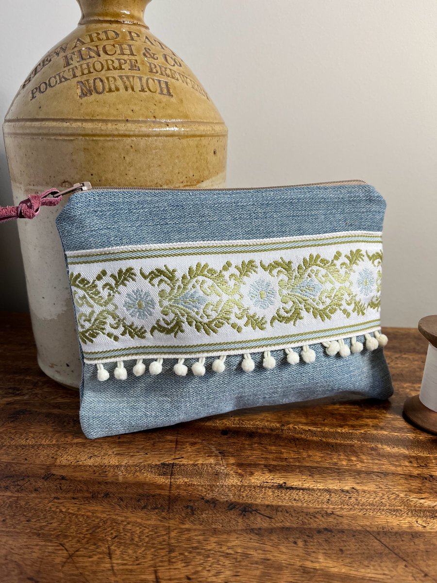 Reclaimed denim and embroidered braid zip pouch with mini pompom trim