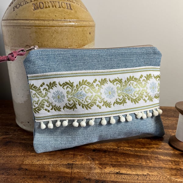 Reclaimed denim and embroidered braid zip pouch with mini pompom trim