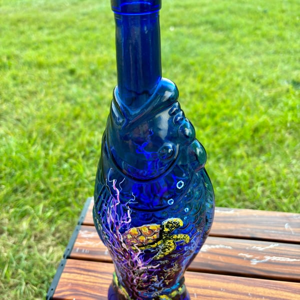 A hand painted and fired fish glass bottle vase by Andrew Jenkins 