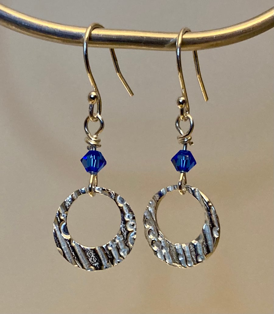 Circular dangly earrings with blue Swarovski crystal beads 