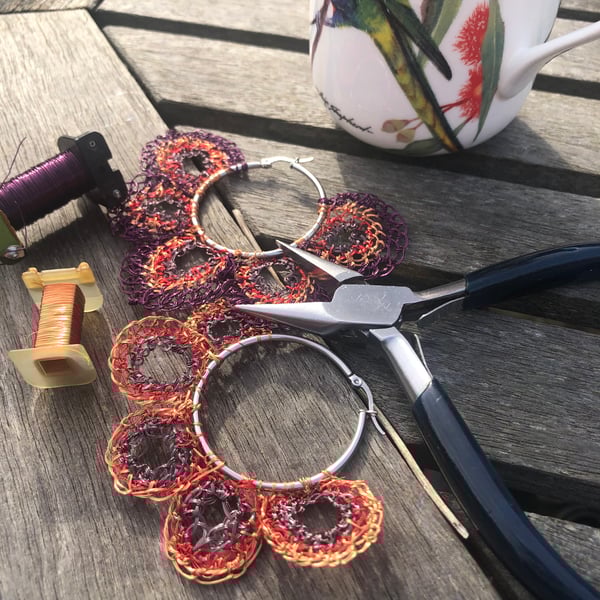 Purple and copper wire hoops