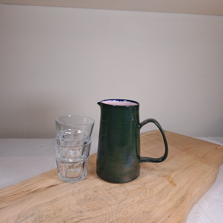 HAND MADE CERAMIC JUG - with a pale pink and dark green glaze