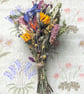 A small bunch of dried flowers and foliage. 17x10cm