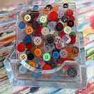 4 square coasters in a holder