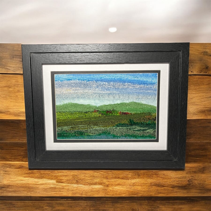 Needle felted picture, silk and wool textile art, distant hills framed