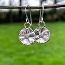 Small sterling silver flower earrings with faceted Ceylon sapphire centres