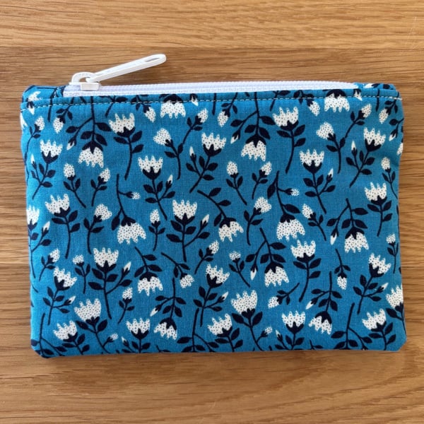Small zipped fabric coin purse, pouch, in blue floral design.
