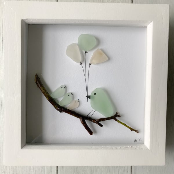 Framed ‘birds and balloons’ art made with sea glass from Cornish beaches 