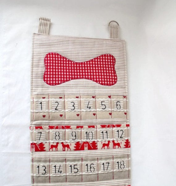 dog hanging christmas advent calendar for storing small gifts or treats in