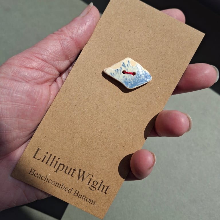 Large diamond shaped blue and white sea pottery button