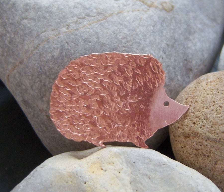 Hedgehog brooch in copper