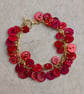 Red button bracelet with gold chain and toggle clasp  - Image 2