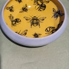 Circular yellow bee patterned trinket dish headband pottery