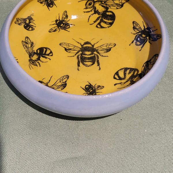 Circular yellow bee patterned trinket dish headband pottery