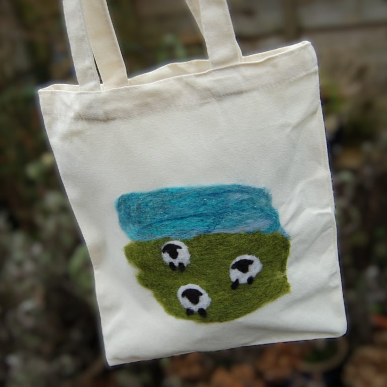 Canvas tote bag embellished with a needle felted sheep landscape
