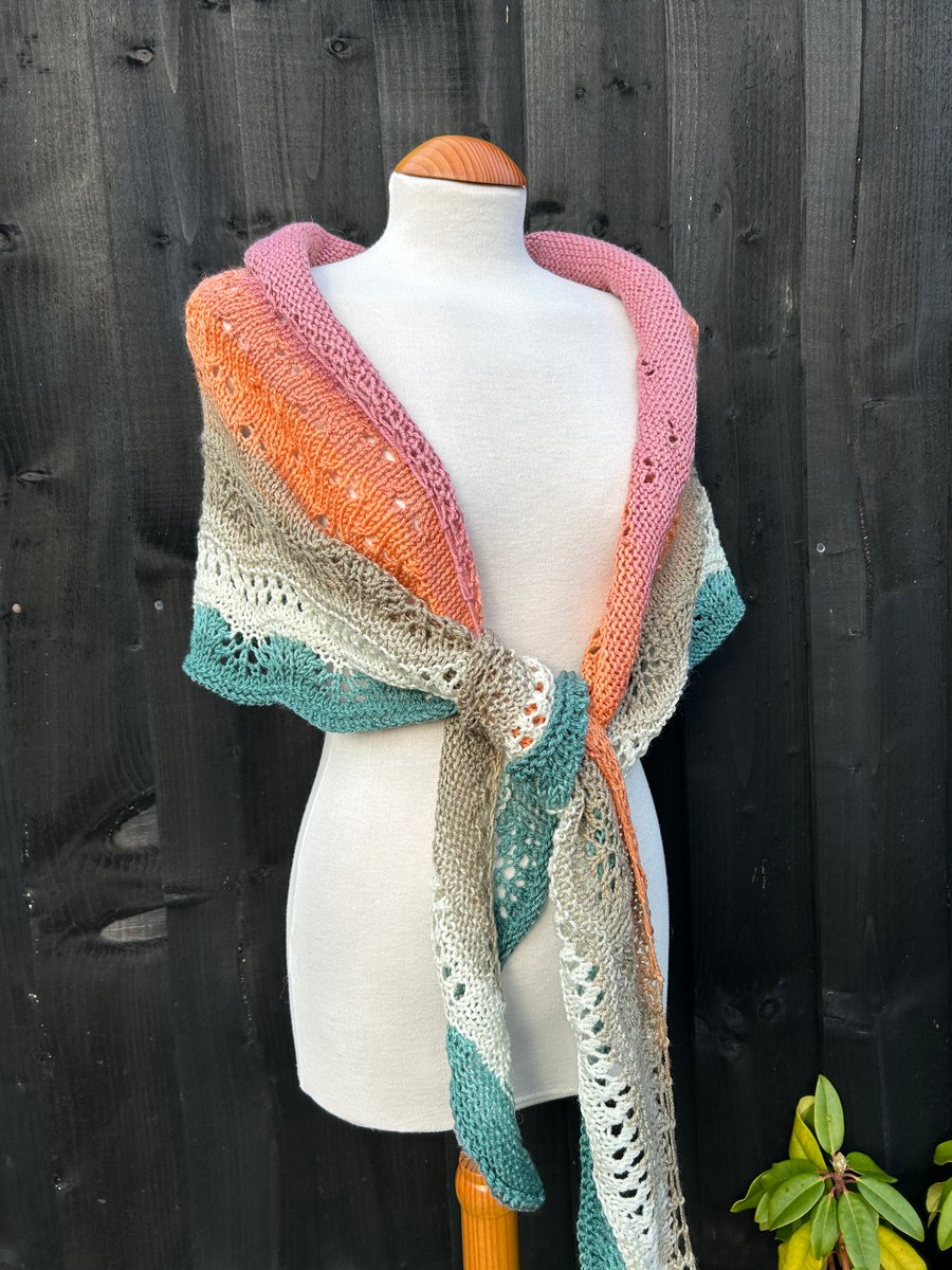 Unique hand knitted extremely shallow crescent wrap scarf in soft wool yarn cake